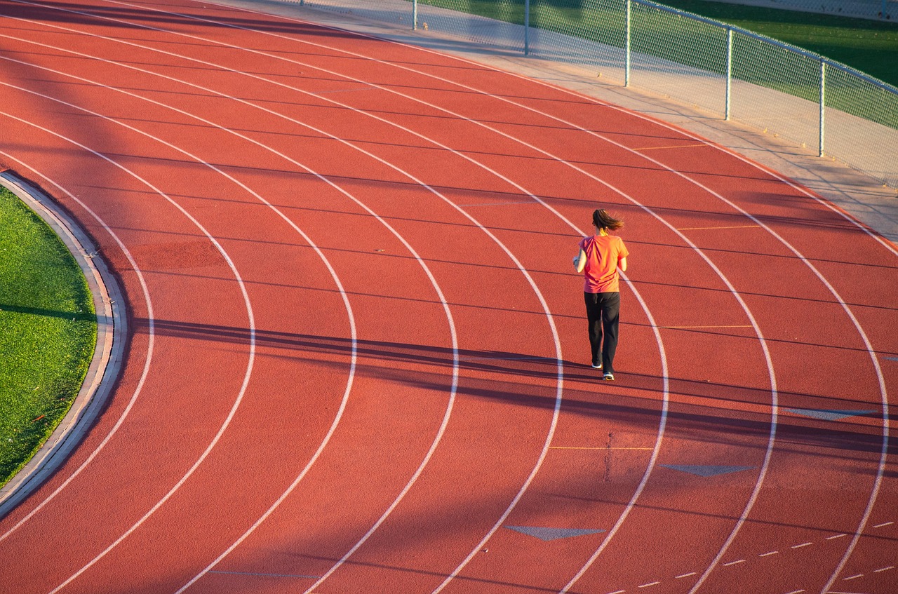 Running, woman, track — Unlock Your Potential: The Ultimate TRT Treatment Near Me